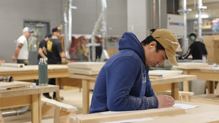 Students are pictured in the carpentry lab at the Southern Alberta Institute of Technology. 