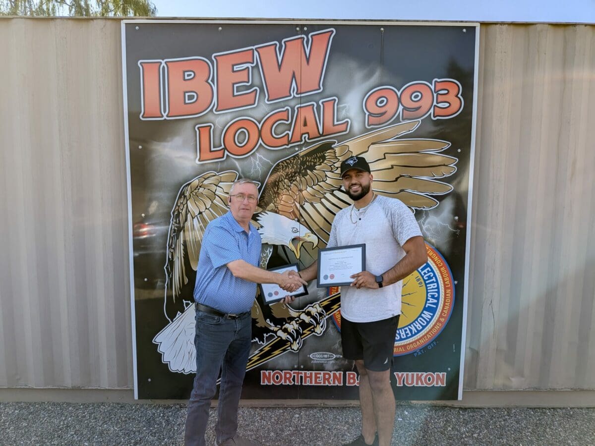 Sukhmit Toor receiving his Red Seal from Business Manager Jim Bicknell