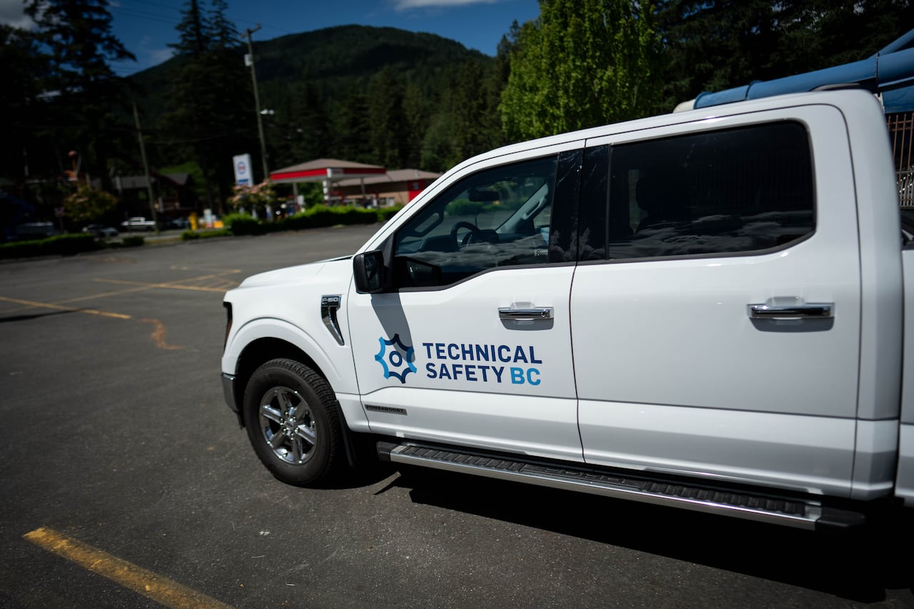 A white pickup truck parked at the waterpark with the writing "technical safety BC" on the side.